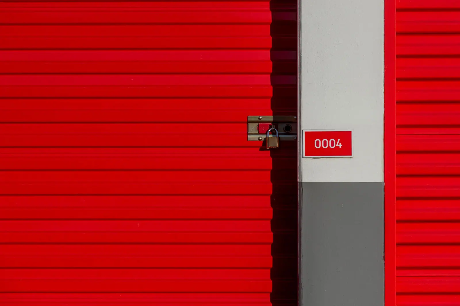Numbered red door of a locked storage unit