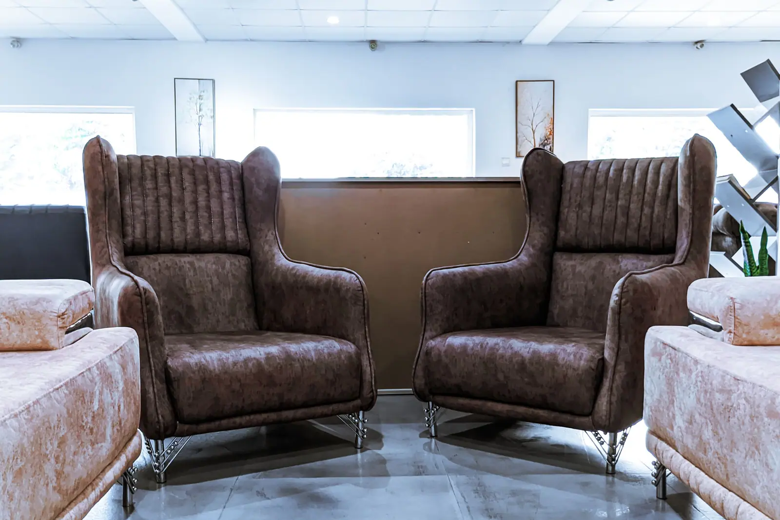 Two leather armchairs in a bright living room